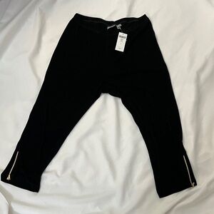 Elegant Black Cropped Pants with Gold Zippers